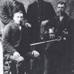 George Pariseau's father and uncles. Augustin is the one with the fiddle.